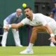 Serbia's Novak Djokovic plays a forehand return to Vit Kopriva of the Czech Republic during their first round match at the Wimbledon tennis championships in London, Tuesday, July 2, 2024. (AP Photo/Kirsty Wigglesworth)