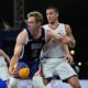 Canyon Barry of the United States fends off Mihailo Vasic of Serbia in the men's 3x3 basketball pool round match between Serbia and the United States at the 2024 Summer Olympics, Tuesday, July 30, 2024, in Paris, France. (AP Photo/Rebecca Blackwell)