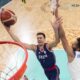 Filip Petrusev, of Serbia, shoots around dGeorge Conditt IV, of Puerto Rico, in a men's basketball game in a men's basketball game at the 2024 Summer Olympics, Wednesday, July 31, 2024, in Villeneuve-d'Ascq, France. (AP Photo/Mark J. Terrill, Pool)