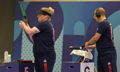 Serbia's Zorana Arunovic, left, and Damir Mikec get ready to compete in the 10m air pistol mixed team gold medal event at the 2024 Summer Olympics, Tuesday, July 30, 2024, in Chateauroux, France. (AP Photo/Manish Swarup)