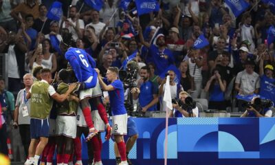 France players celebrate after Alexandre Lacazette scored his side's first goal during the men's Group A soccer match between France and the United States at the Velodrome stadium, during the 2024 Summer Olympics, Wednesday, July 24, 2024, in Marseille, France. (AP Photo/Daniel Cole)