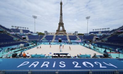 Players from the Netherlands, left, and Switzerland, practice beach volleyball at the 2024 Summer Olympics, Thursday, July 25, 2024, in Paris, France. (AP Photo/Robert F. Bukaty)