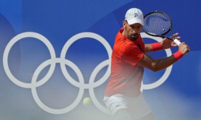 Novak Djokovic of Serbia returns the ball during a practice session ahead of the tennis competition, at the 2024 Summer Olympics, Thursday, July 25, 2024, in Paris, France. (AP Photo/Andy Wong)