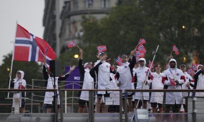 Norway team parades along the Seine river in Paris, France, during the opening ceremony of the 2024 Summer Olympics, Friday, July 26, 2024.. (AP Photo/Luca Bruno)