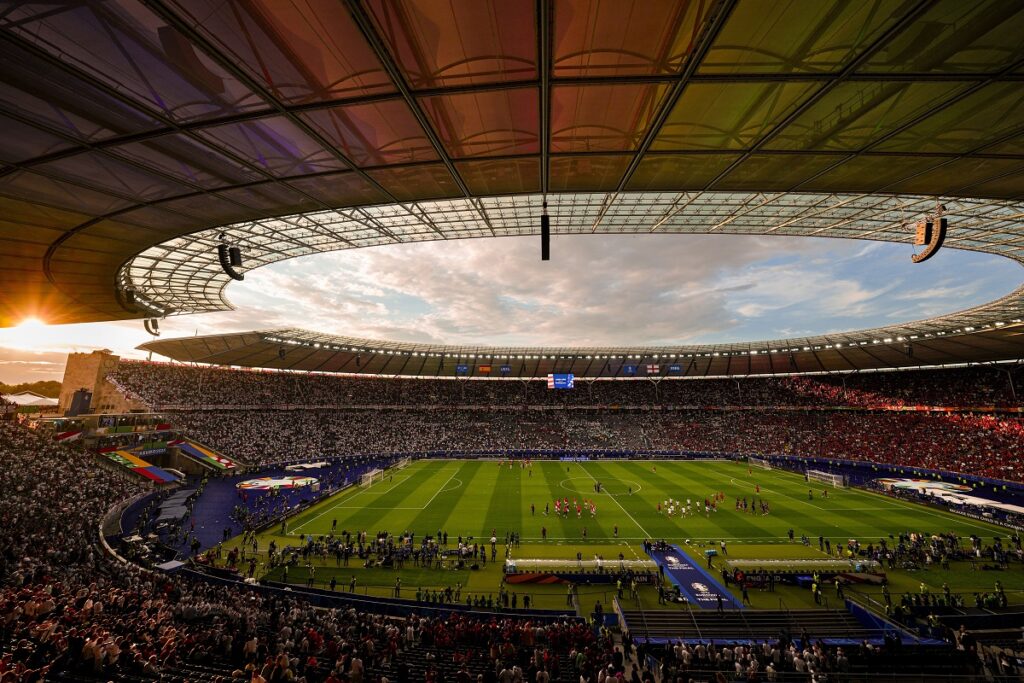 Players of the two teams warm up before the final match between Spain and England at the Euro 2024 soccer tournament in Berlin, Germany, Sunday, July 14, 2024. (AP Photo/Andreea Alexandru)