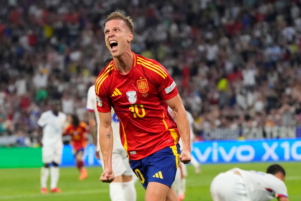 Spain's Dani Olmo celebrates after scoring his side's second goal during a semifinal match between Spain and France at the Euro 2024 soccer tournament in Munich, Germany, Tuesday, July 9, 2024. (AP Photo/Manu Fernandez)