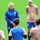 England's coach Sarina Wiegman, rear second left, talks to players during a training session of the national women's soccer team in Gothenburg, Sweden, Monday, July 15, 2024, on the eve of the UEFA Women's Euro qualification match between Sweden and England. (Bjorn Larsson Rosvall/TT News Agency via AP)