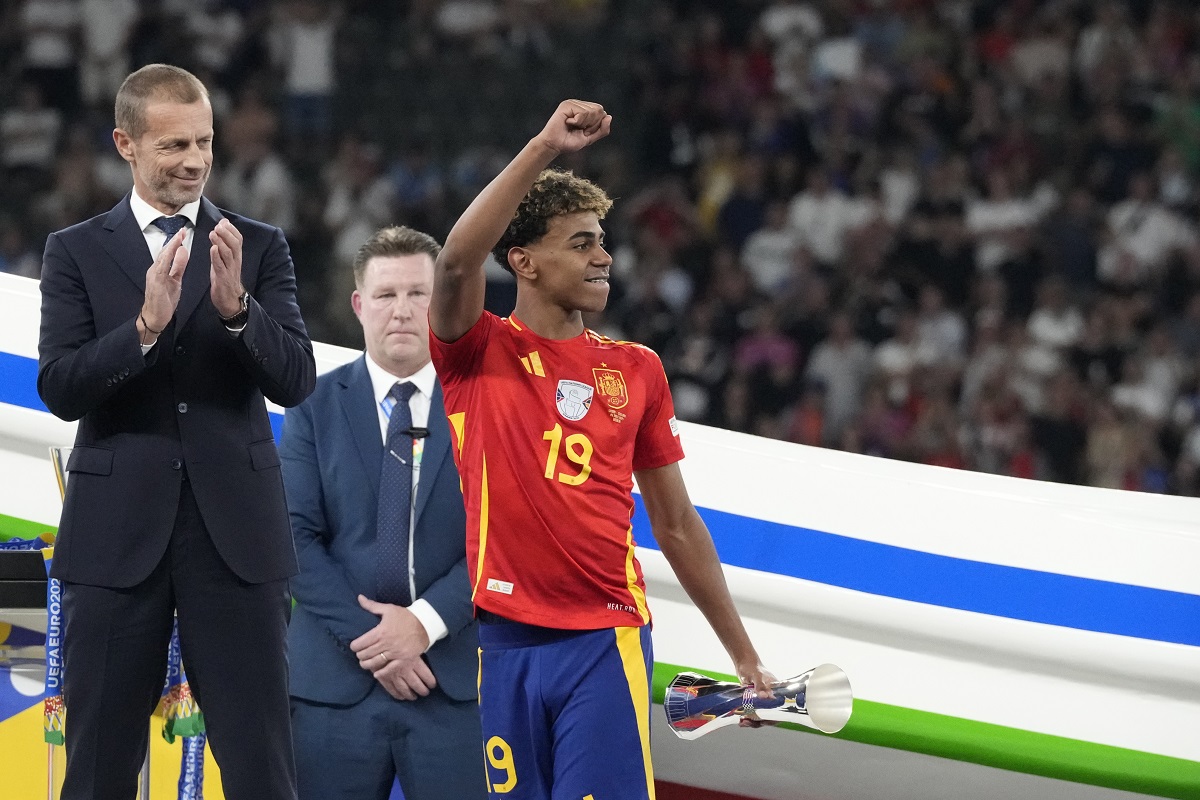 Spain's Lamine Yamal smiles after winning the final match between Spain and England at the Euro 2024 soccer tournament in Berlin, Germany, Sunday, July 14, 2024. (AP Photo/Frank Augstein)