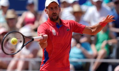 Serbia's Novak Djokovic returns the ball to Spain's Rafael Nadal during their men's singles second round match at the 2024 Summer Olympics, Monday, July 29, 2024, at the Roland Garros stadium in Paris, France. (AP Photo/Andy Wong)