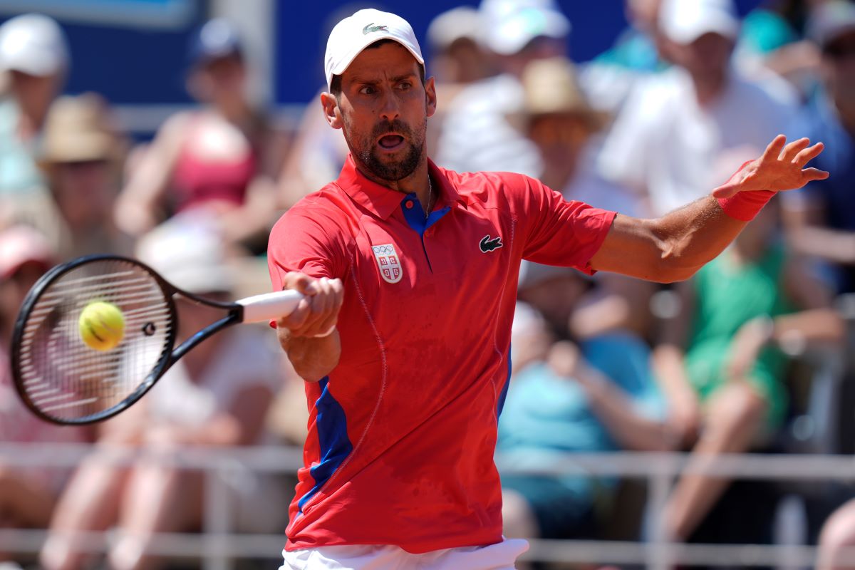 Serbia's Novak Djokovic returns the ball to Spain's Rafael Nadal during their men's singles second round match at the 2024 Summer Olympics, Monday, July 29, 2024, at the Roland Garros stadium in Paris, France. (AP Photo/Andy Wong)