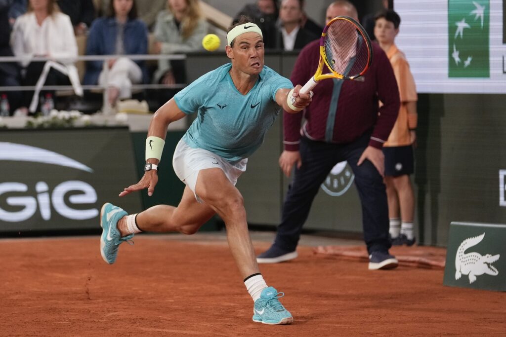 FILE - Spain's Rafael Nadal plays a shot against Germany's Alexander Zverev during their first-round match of the French Open tennis tournament at the Roland Garros stadium in Paris, May 27, 2024. For the first time in more than 30 years, the tennis competition at an Olympics will be held on red clay, which means players who just made the adjustment from the dirt at the French Open in early June to grass at Wimbledon in early July now will need to reverse course again in short order. (AP Photo/Thibault Camus, File)