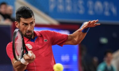 Serbian tennis player Novak Djokovic returns the ball against Matthew Ebden of Australia during the men's singles tennis competition, at the 2024 Summer Olympics, Saturday, July 27, 2024, in Paris, France. (AP Photo/Manu Fernandez)