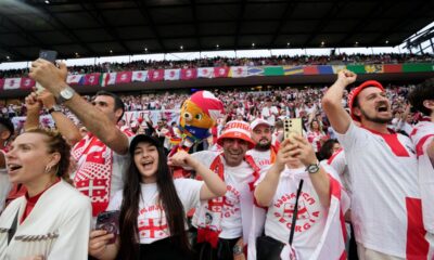 Georgia fans cheer during a round of sixteen match between Spain and Georgia at the Euro 2024 soccer tournament in Cologne, Germany, Sunday, June 30, 2024. (AP Photo/Martin Meissner)