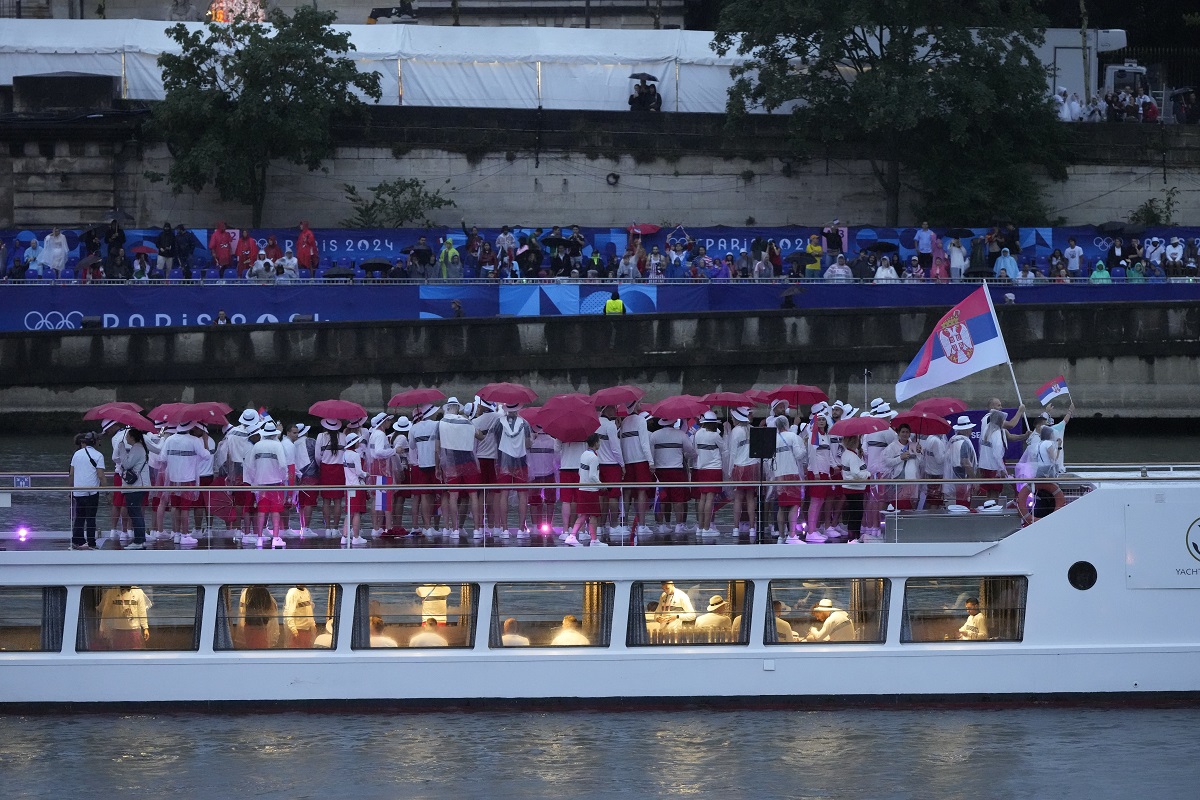 Serbia team parades along the Seine river in Paris, France, during the opening ceremony of the 2024 Summer Olympics, Friday, July 26, 2024. (AP Photo/Charlie Riedel)