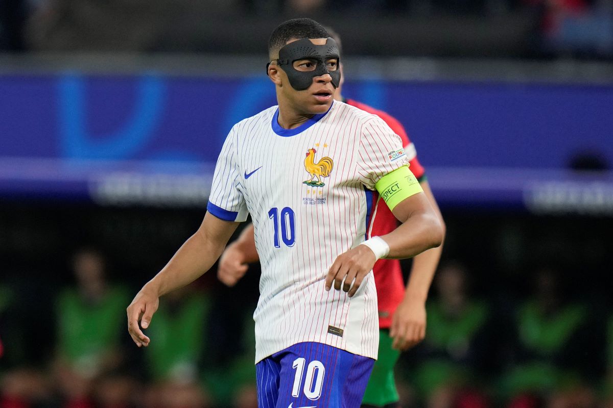 Kylian Mbappe of France looks over his shoulder during a quarter final match against Portugal at the Euro 2024 soccer tournament in Hamburg, Germany, Friday, July 5, 2024. (AP Photo/Hassan Ammar)