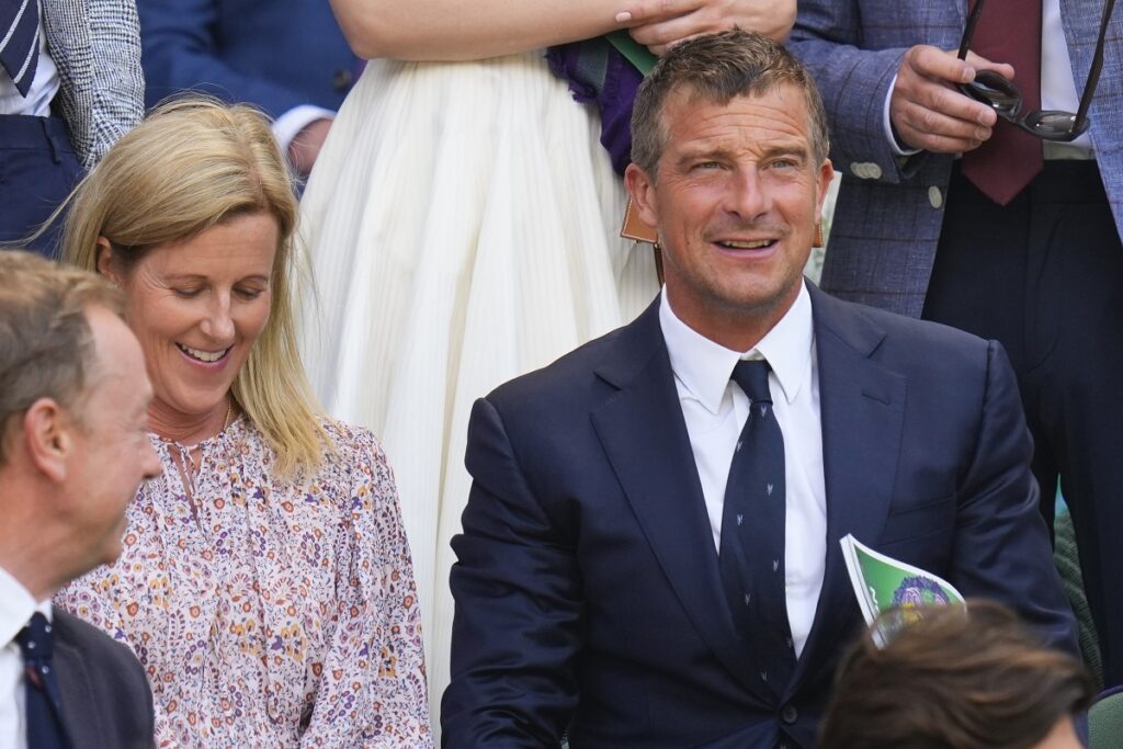 Bear Grylls and his wife Shara on Center Court for the second round match between Serbia's Novak Djokovic and Britain's Jacob Fearnley at the Wimbledon tennis championships in London, Thursday, July 4, 2024. (AP Photo/Kirsty Wigglesworth)
