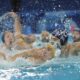 Serbia's Petar Jaksic, right, battles for the ball against Australia's Marcus Berehulak, during a men's water polo Group B preliminary match between Australia and Serbia at the 2024 Summer Olympics, Tuesday, July 30, 2024, in Saint-Denis, France. (AP Photo/Luca Bruno)