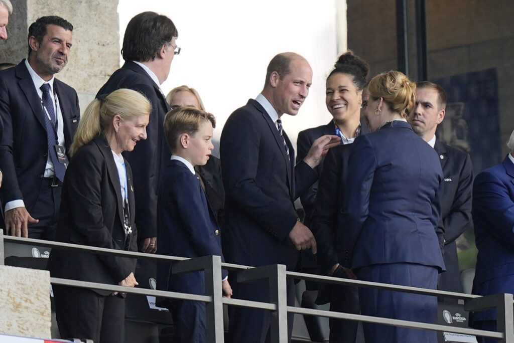 Britain's Prince William, left, and his son Prince George of Wales, left, attend the final match between Spain and England at the Euro 2024 soccer tournament in Berlin, Germany, Sunday, July 14, 2024. (AP Photo/Matthias Schrader)