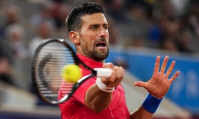 Serbian tennis player Novak Djokovic returns the ball against Matthew Ebden of Australia during the men's singles tennis competition, at the 2024 Summer Olympics, Saturday, July 27, 2024, in Paris, France. (AP Photo/Manu Fernandez)