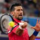 Serbian tennis player Novak Djokovic returns the ball against Matthew Ebden of Australia during the men's singles tennis competition, at the 2024 Summer Olympics, Saturday, July 27, 2024, in Paris, France. (AP Photo/Manu Fernandez)