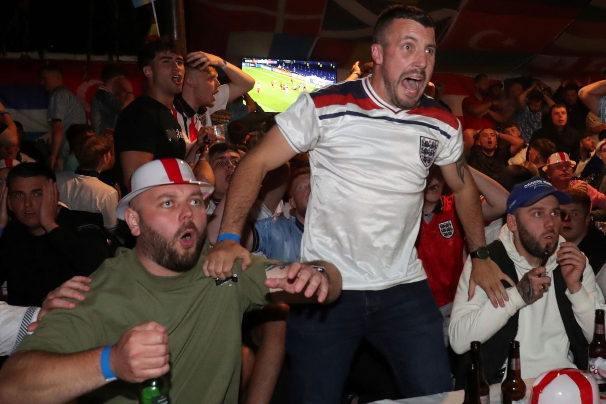 England fans react as they watch on the Euro 2024 final soccer against Spain at a pub in Hebburn, England, Sunday, July 14, 2024. The match is being played in Berlin. (AP Photo/Scott Heppell)