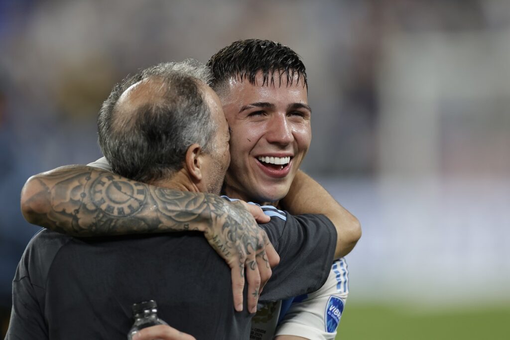 Argentina's Enzo Fernandez is congratulated after beating Canada 2-0 in a Copa America semifinal soccer match in East Rutherford, N.J., Tuesday, July 9, 2024. (AP Photo/Adam Hunger)