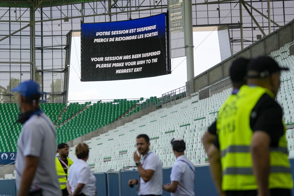 The video screen announces that the match has been suspended during the men's Group B soccer match between Argentina and Morocco at Geoffroy-Guichard Stadium at the 2024 Summer Olympics, Wednesday, July 24, 2024, in Saint-Etienne, France. (AP Photo/Silvia Izquierdo)