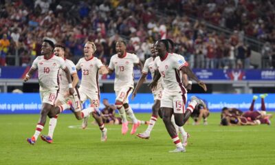 Canada celebrates their win in a Copa America quarterfinal soccer match against Venezuela in Arlington, Texas, Friday, July 5, 2024. (AP Photo/Tony Gutierrez)
