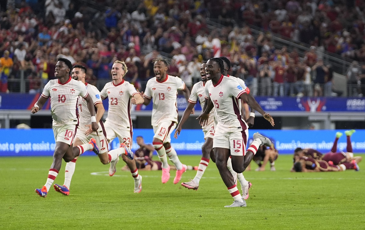 Canada celebrates their win in a Copa America quarterfinal soccer match against Venezuela in Arlington, Texas, Friday, July 5, 2024. (AP Photo/Tony Gutierrez)