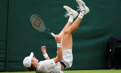 Alex de Minaur of Australia falls during his fourth round match against Arthur Fils of France at the Wimbledon tennis championships in London, Monday, July 8, 2024. (AP Photo/Alberto Pezzali)