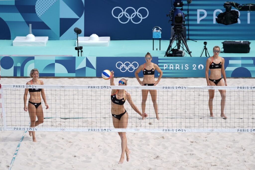 Germany's Louisa Lippman hits at the net during a beach volleyball practice in Eiffel Tower Stadium at the 2024 Summer Olympics, Thursday, July 25, 2024, in Paris, France. (AP Photo/Robert F. Bukaty)