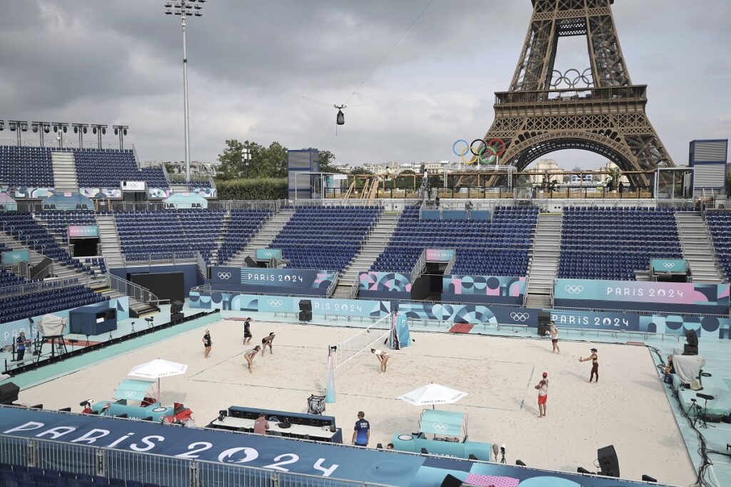 Athletes play at the Tour Eiffel stadium that will host the Beach Volleyball on the Champs-de-Mars, at the 2024 Summer Olympics in Paris, France, Wednesday July 24 2024. (Christophe Petit Tesson, Pool via AP)