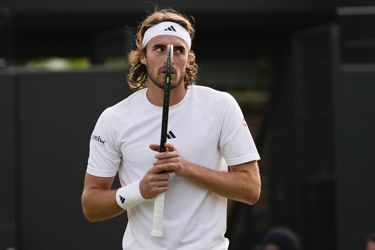 Stefanos Tsitsipas of Greece reacts during his second round match against Emil Ruusuvuori of Finland at the Wimbledon tennis championships in London, Thursday, July 4, 2024. (AP Photo/Alberto Pezzali)