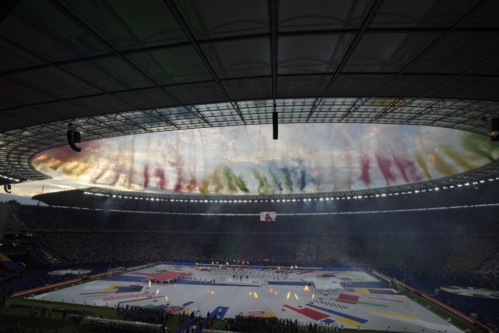 Fire works illuminates the sky prior to the final match between England and Spain at the Euro 2024 soccer tournament in Berlin, Germany, Sunday, July 14, 2024. (AP Photo/Thanassis Stavrakis)