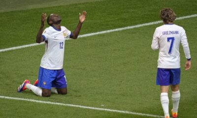 Randal Kolo Muani of France celebrates after his shot was deflected in the net by Belgium's Jan Vertonghen during a round of sixteen match between France and Belgium at the Euro 2024 soccer tournament in Duesseldorf, Germany, Monday, July 1, 2024. (AP Photo/Andreea Alexandru)