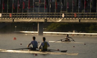 Athletes train ahead of the day's rowing competitions at the 2024 Summer Olympics, Sunday, July 28, 2024, in Vaires-sur-Marne, France. (AP Photo/Lindsey Wasson)