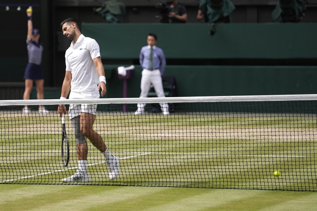 Novak Djokovic of Serbia reacts after losing a point to Carlos Alcaraz of Spain during the men's singles final at the Wimbledon tennis championships in London, Sunday, July 14, 2024. (AP Photo/Alberto Pezzali)