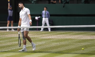 Novak Djokovic of Serbia reacts after losing a point to Carlos Alcaraz of Spain during the men's singles final at the Wimbledon tennis championships in London, Sunday, July 14, 2024. (AP Photo/Alberto Pezzali)