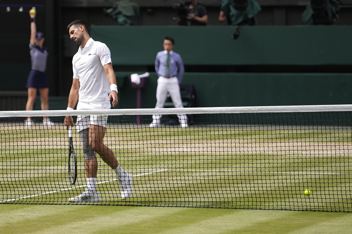 Novak Djokovic of Serbia reacts after losing a point to Carlos Alcaraz of Spain during the men's singles final at the Wimbledon tennis championships in London, Sunday, July 14, 2024. (AP Photo/Alberto Pezzali)