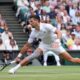 Novak Djokovic of Serbia plays a backhand return to Lorenzo Musetti of Italy during their semifinal match at the Wimbledon tennis championships in London, Friday, July 12, 2024. (AP Photo/Kirsty Wigglesworth)