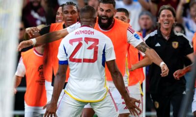 Venezuela's Salomon Rondon (23) is greeted by Jhon Chancerllor and teammates after scoring a second half goal during a Copa America Group B soccer match between Jamaica and Venezuela, Sunday, June 30, 2024, in Austin, Texas. (AP Photo/Eric Gay)