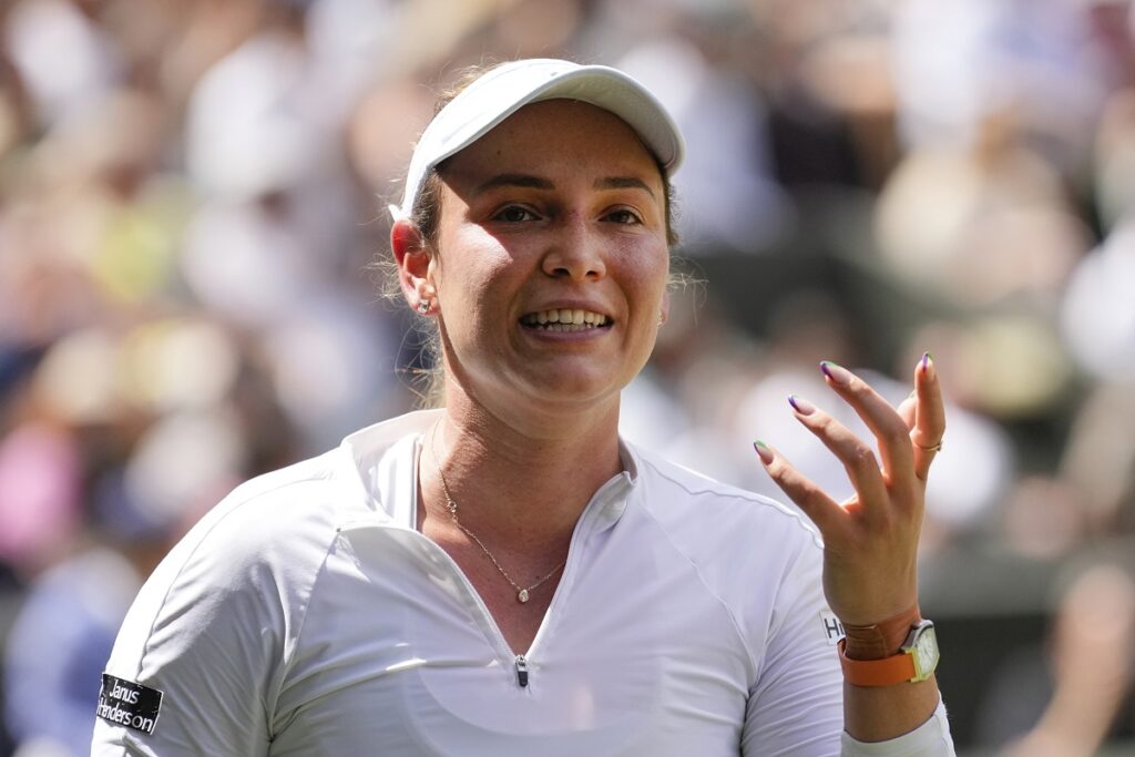 Donna Vekic of Croatia reacts towards her coaches as she plays against Jasmine Paolini of Italy during their semifinal match at the Wimbledon tennis championships in London, Thursday, July 11, 2024. (AP Photo/Mosa'ab Elshamy)