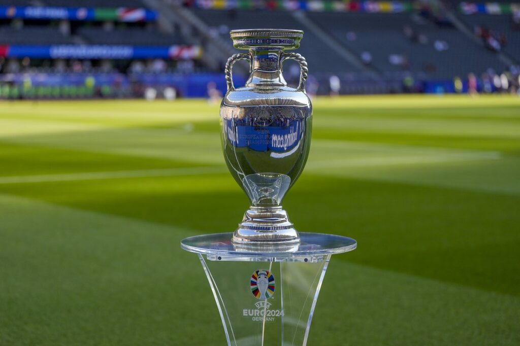 The Euro 2024 trophy is seen next to the pitch prior to the start of the final match between Spain and England at the Euro 2024 soccer tournament in Berlin, Germany, Sunday, July 14, 2024. (AP Photo/Matthias Schrader)