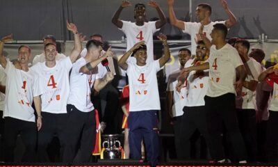 Spain's team captain Alvaro Morata introduces player Lamine Yamal, center, to the fans during celebrations of the Spanish team's European soccer championship title on a stage at Cibeles square in Madrid, Monday, July 15, 2024. Spain defeated England in the final of the Euro 2024 soccer tournament in Berlin on Sunday evening. (AP Photo/Andrea Comas)
