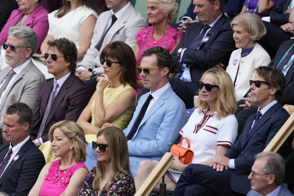 Tom Cruise, second left, with Sophie Hunter, Benedict Cumberbatch, Julia Roberts and Daniel Moder, right, watch the men's singles final between Carlos Alcaraz of Spain and Novak Djokovic of Serbia from the Royal Box at the Wimbledon tennis championships in London, Sunday, July 14, 2024. (AP Photo/Mosa'ab Elshamy)