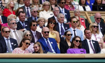 Britain's Kate, the Princess of Wales, her sister Pippa, left and Princess Charlotte sit in the royal box to watch the men's singles final between Carlos Alcaraz of Spain and Novak Djokovic of Serbia, at the Wimbledon tennis championships in London, Sunday, July 14, 2024. (Mike Egerton/PA via AP)