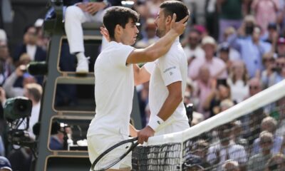 Carlos Alcaraz, left, of Spain is congratulated by Novak Djokovic of Serbia after winning the men's singles final at the Wimbledon tennis championships in London, Sunday, July 14, 2024. (AP Photo/Kirsty Wigglesworth)