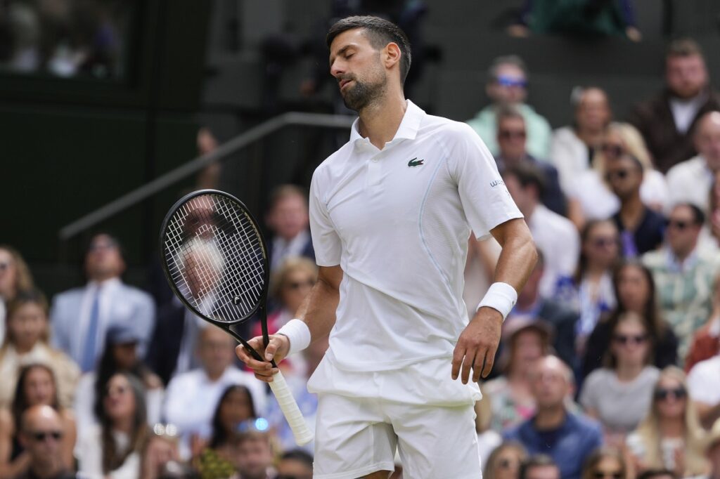 Novak Djokovic of Serbia reacts after losing a point to Carlos Alcaraz of Spain during the men's singles final at the Wimbledon tennis championships in London, Sunday, July 14, 2024. (AP Photo/Kirsty Wigglesworth)