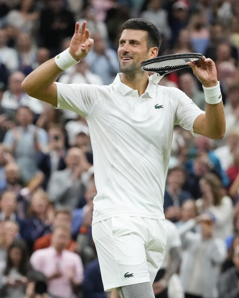 Novak Djokovic of Serbia reacts after defeating Alexei Popyrin of Australia in their third round match at the Wimbledon tennis championships in London, Saturday, July 6, 2024. (AP Photo/Kirsty Wigglesworth)