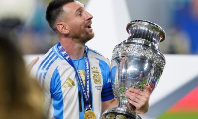 Argentina's Lionel Messi celebrates with the trophy after his team defeated Colombia in the Copa America final soccer match in Miami Gardens, Fla., Monday, July 15, 2024. (AP Photo/Rebecca Blackwell)